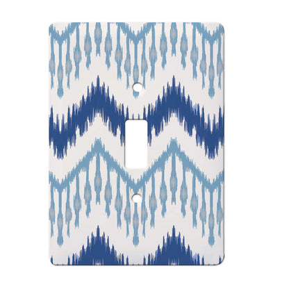 ceramic single toggle switchplate featuring ikat pattern in various shades of blue. 