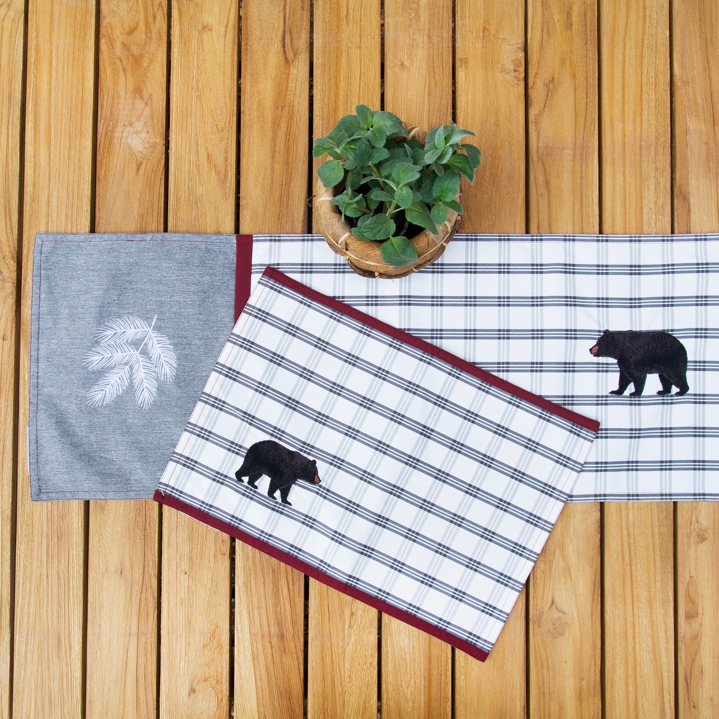 Bear Lodge Outdoor Tabletop on a table outside with a plant