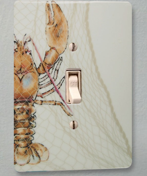 ceramic single toggle switch plate featuring netting and a illustrative graphic of a lobster.