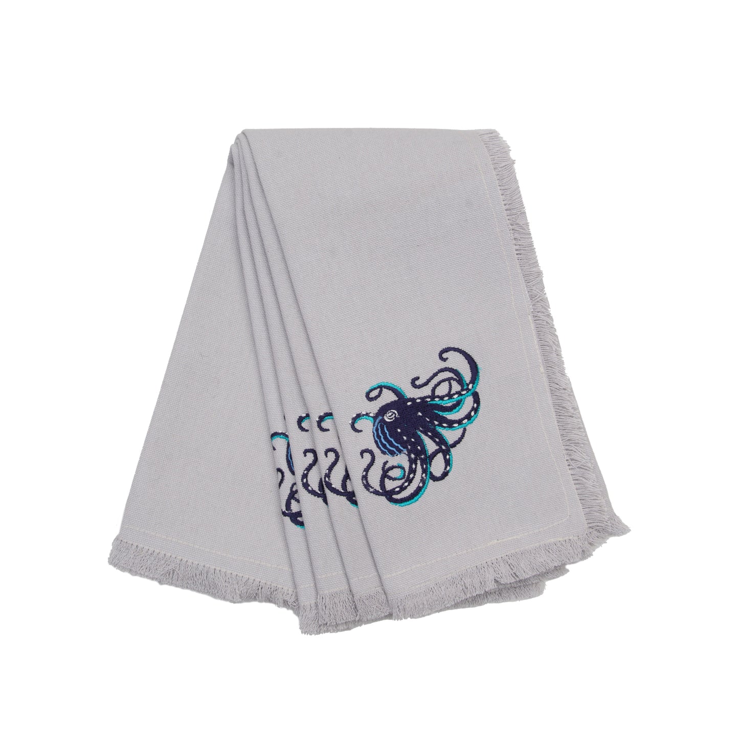 Navy octopus with teak tentacles embroidered on fringed grey cotton napkins.