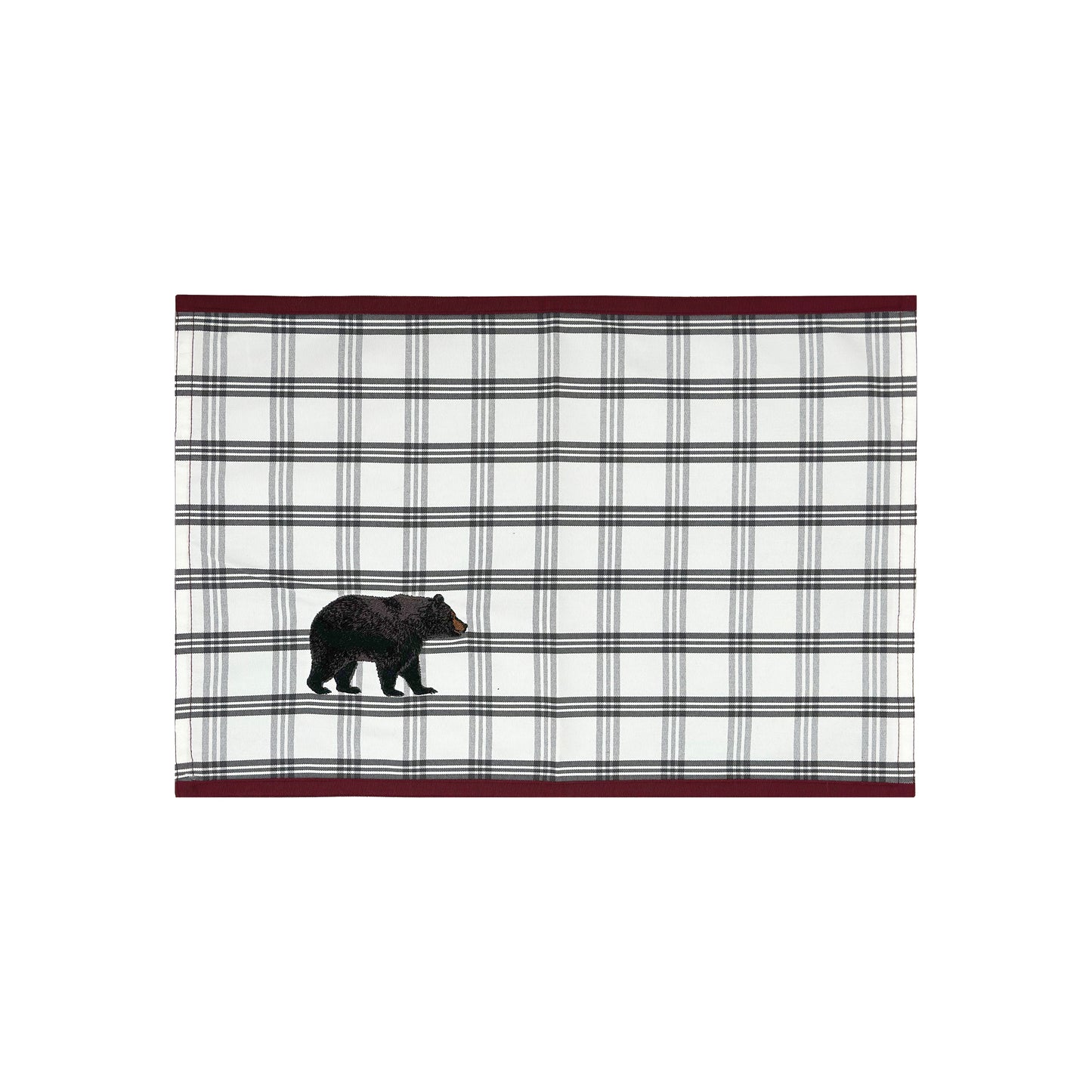 White placemat with grey plaid and a black bear in the right corner featuring a red border on the top and bottom