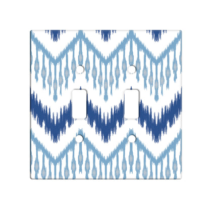 ceramic double toggle switchplate featuring ikat pattern in various shades of blue. 