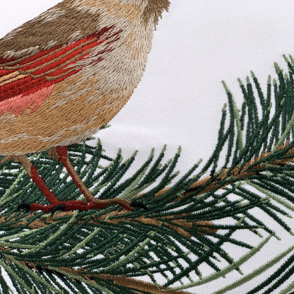 Detail shot of the embroidery on the Cardinals and Pines pillow.