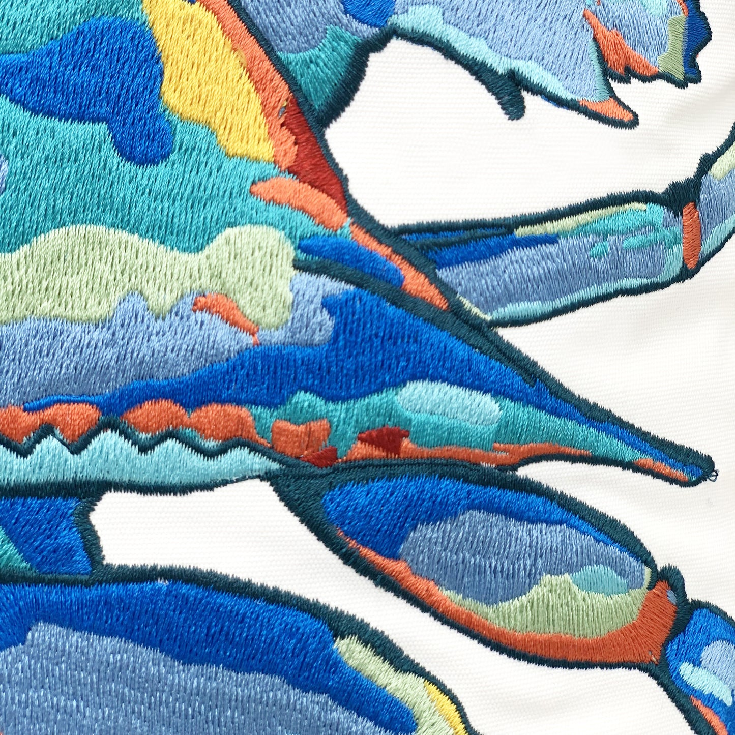 Detail shot of the Tropical Punch Happy Crab indoor outdoor embroidery work.