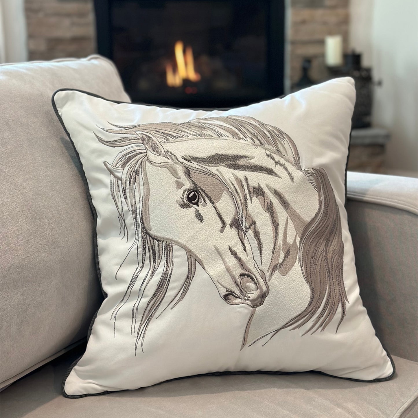 Head Strong Left pillow styled on a grey couch.