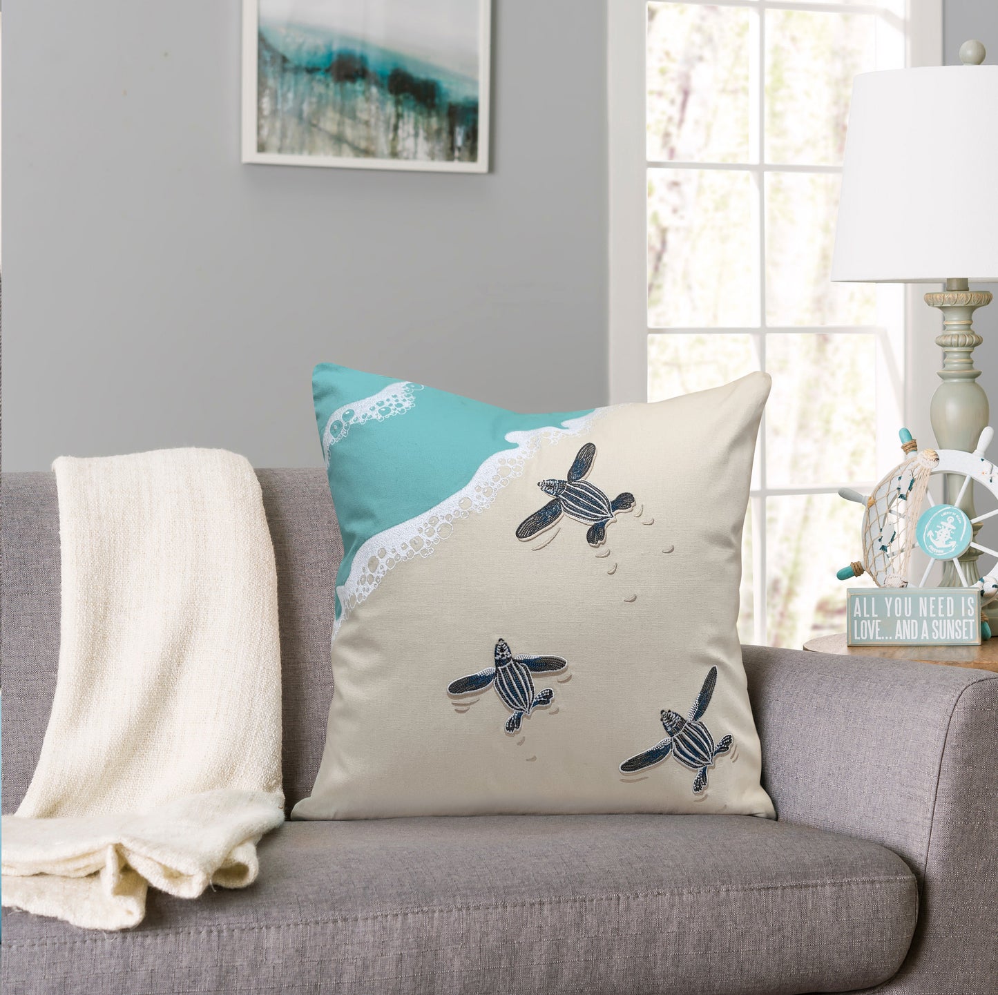 Leatherback Scurry indoor outdoor pillow styled in a coastal living room.
