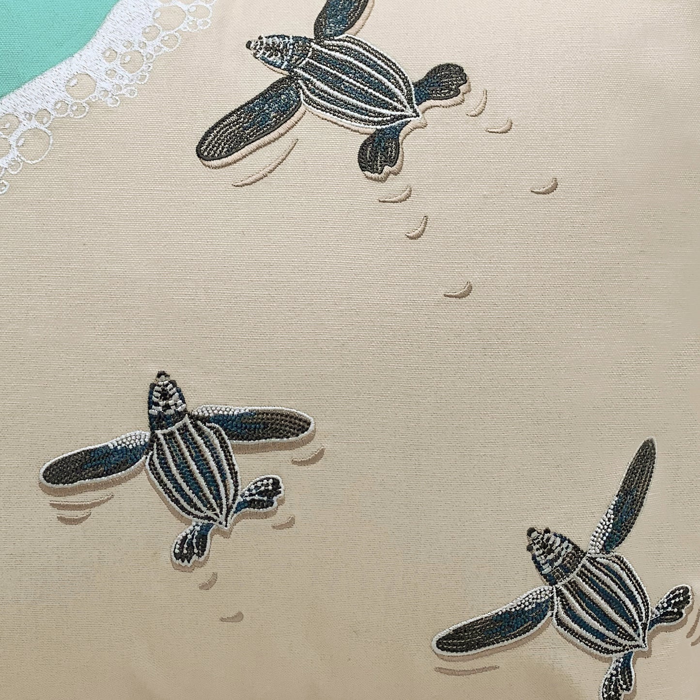 Detail shot of the Leatherback Turtle Pillows embroidery.