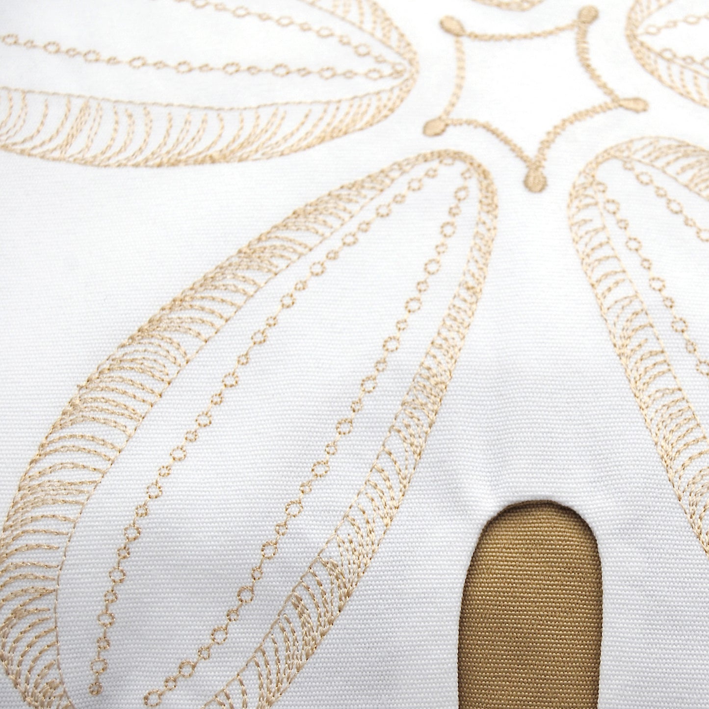 Detailed shot of the Sand Dollar Shaped Beige Indoor Outdoor Pillow