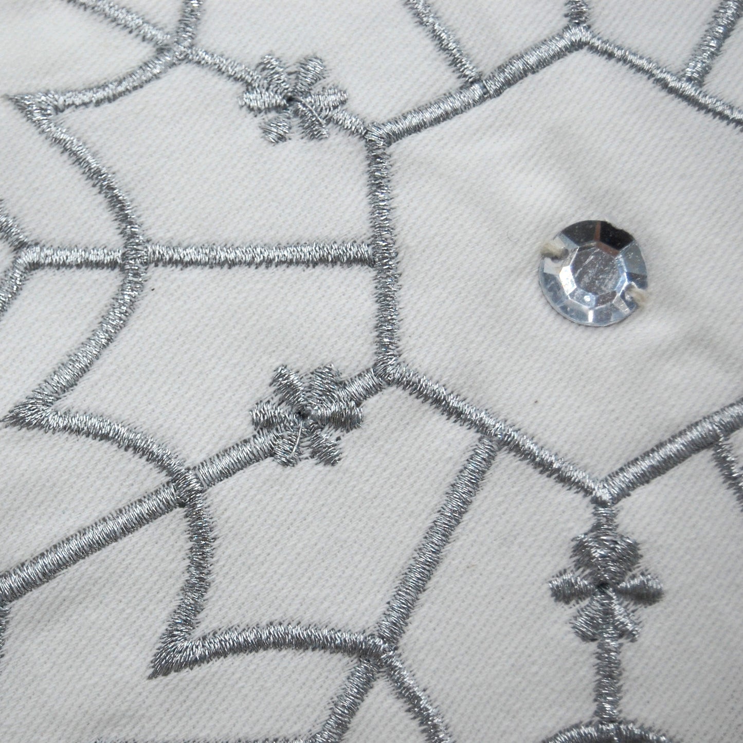 Detail shot of the Snowflake Shaped pillow.