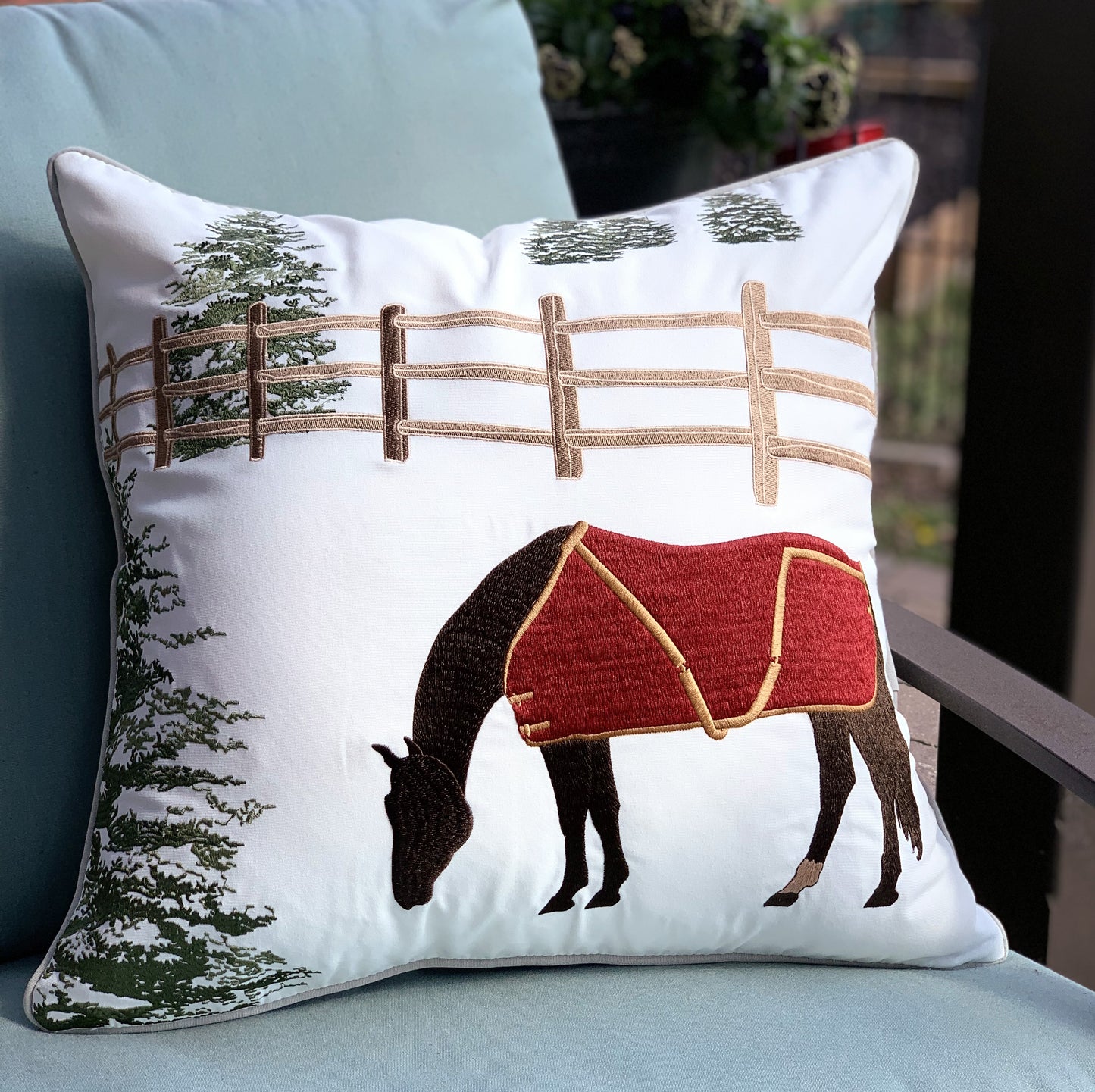 Winter Chill Neutral Indoor Outdoor Pillow styled on a patio chair.
