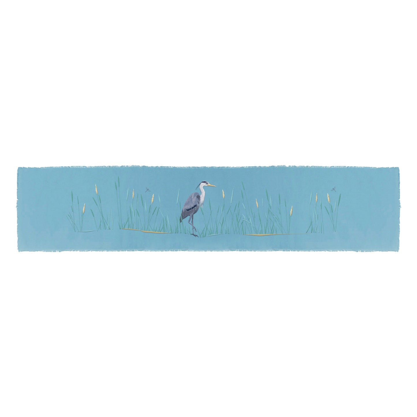 Blue Heron in the reeds embroidered on blue cotton fabric with fringe edged placemat..