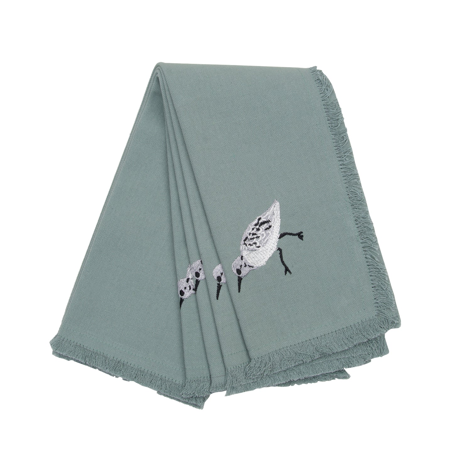 Set of 4 blue fringed cotton napkins with embroidered sandpiper adornment.