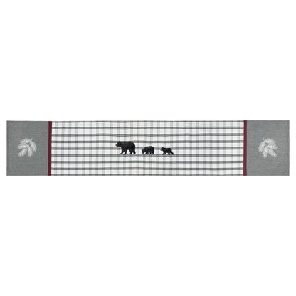 White Runner with grey plaid the middle separated by a red border, grey ends with white pine branches. also featuring 3 black bears in the middle
