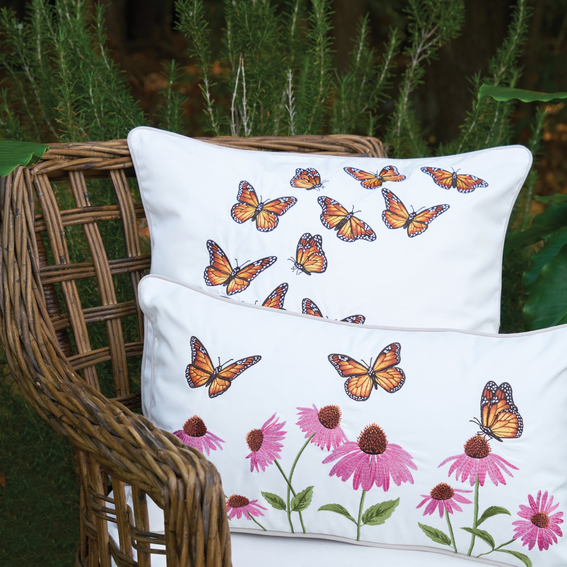 Butterfly Kaleidoscope Pillow behind the Butterfly Garden Lumbar Pillow
on a pillow outside