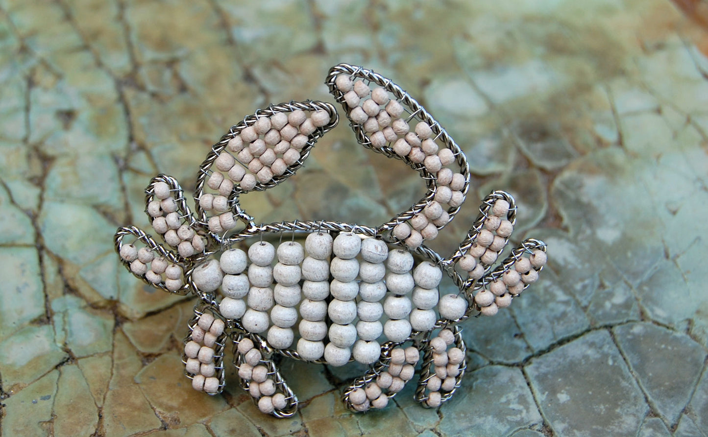 Crab shaped napkin rings crafted of natural beads.