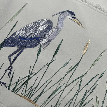 Zoom in detail of embroidery of Great Blue Heron on Grey Cotton Backing