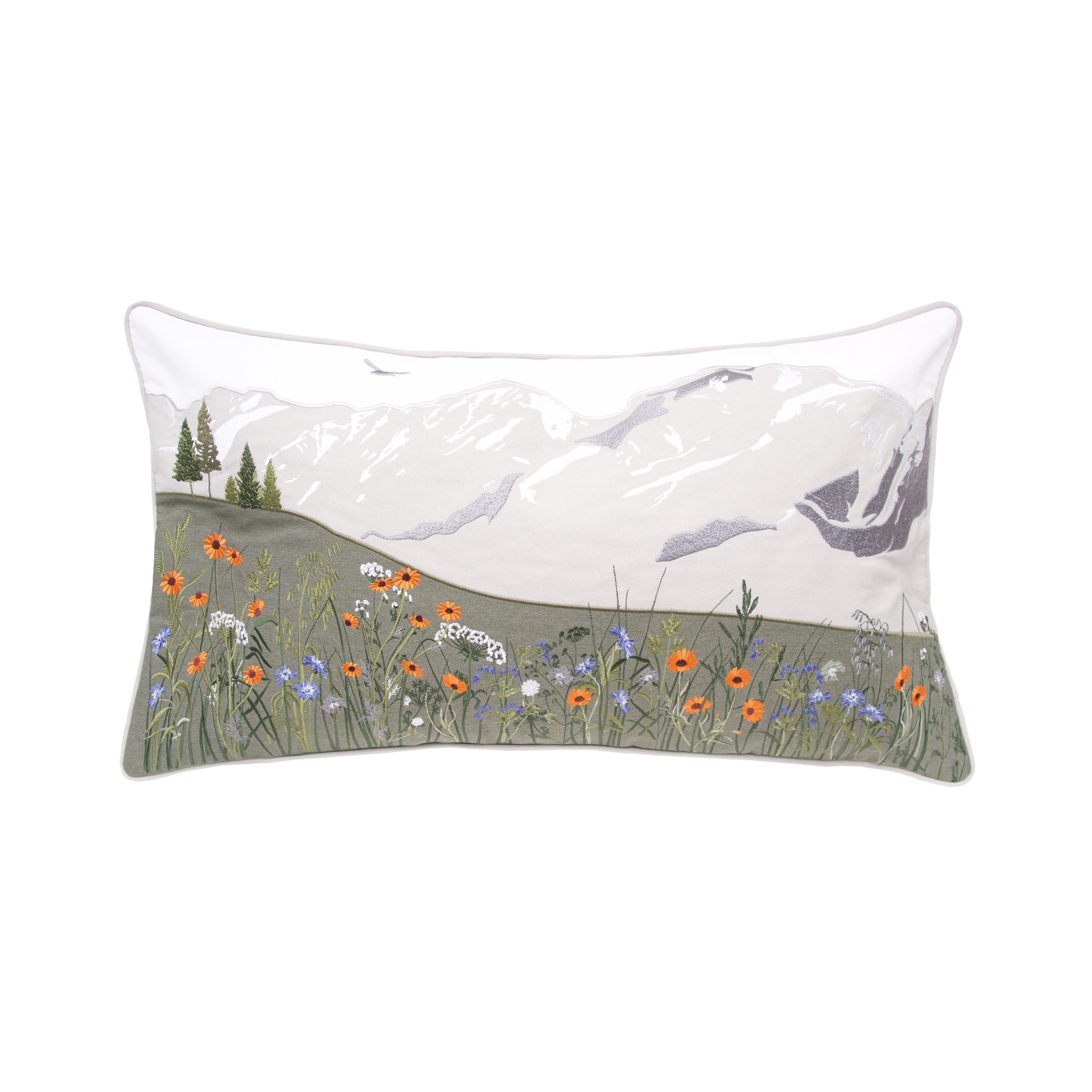 White pillow with grey mountains and colorful wildflowers at the for front