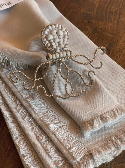 Octopus shaped napkin ring crafted of natural beads.