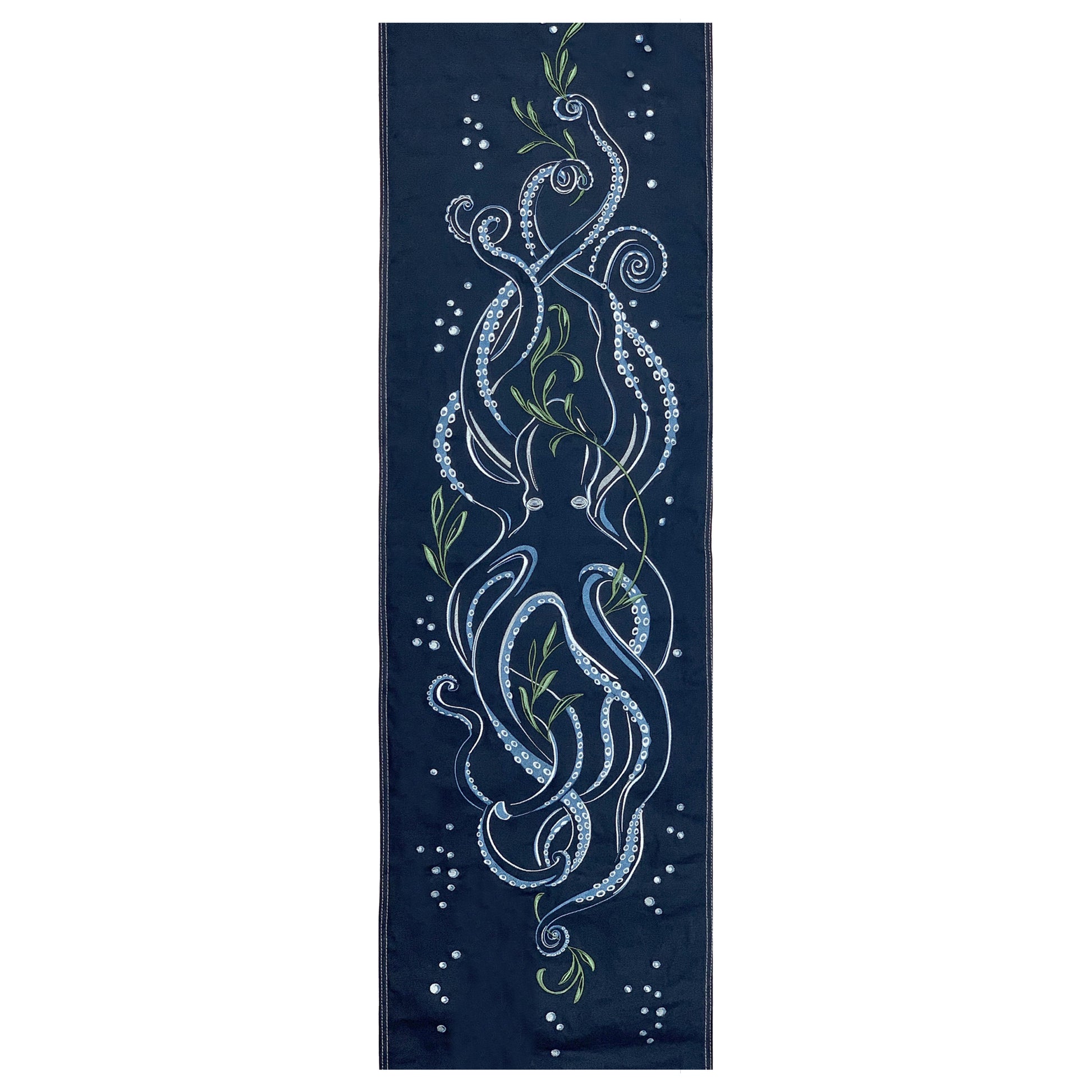 Octopus and seaweed embroidered on a deep ocean blue cotton panel.