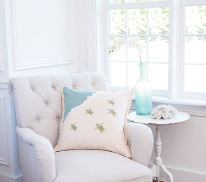 Turtle Migration Embroidered Pillow with Fringed Edges on Interior Chair
