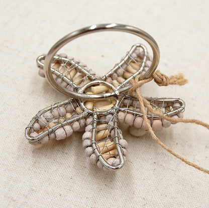 Underside of Sea star shaped napkin ring crafted of natural beads.