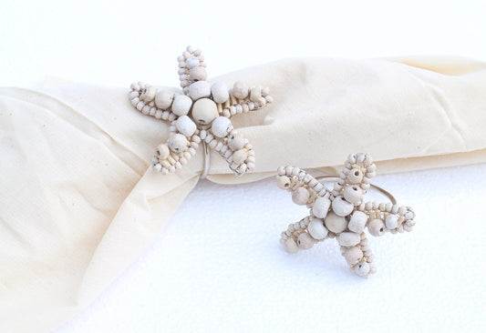 Sea star shaped napkin rings crafted of natural beads.