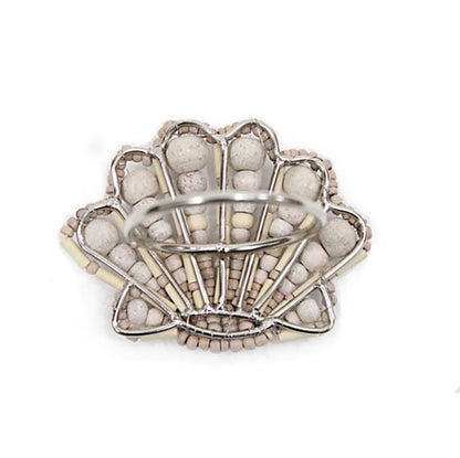 Scallop shell shaped napkin ring crafted of natural wooden beads and metal wire reverse.