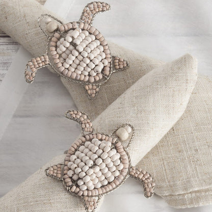 Sea Turtle shaped napkin ring crafted of natural beads. 