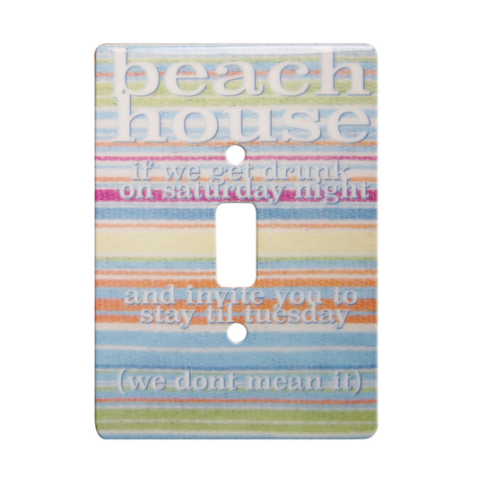 ceramic single toggle switchplate featuring a multi-colored striped background and text that reads "beach house if we get drunk on a saturday night and invite you to stay til tuesday (we dont mean it)".