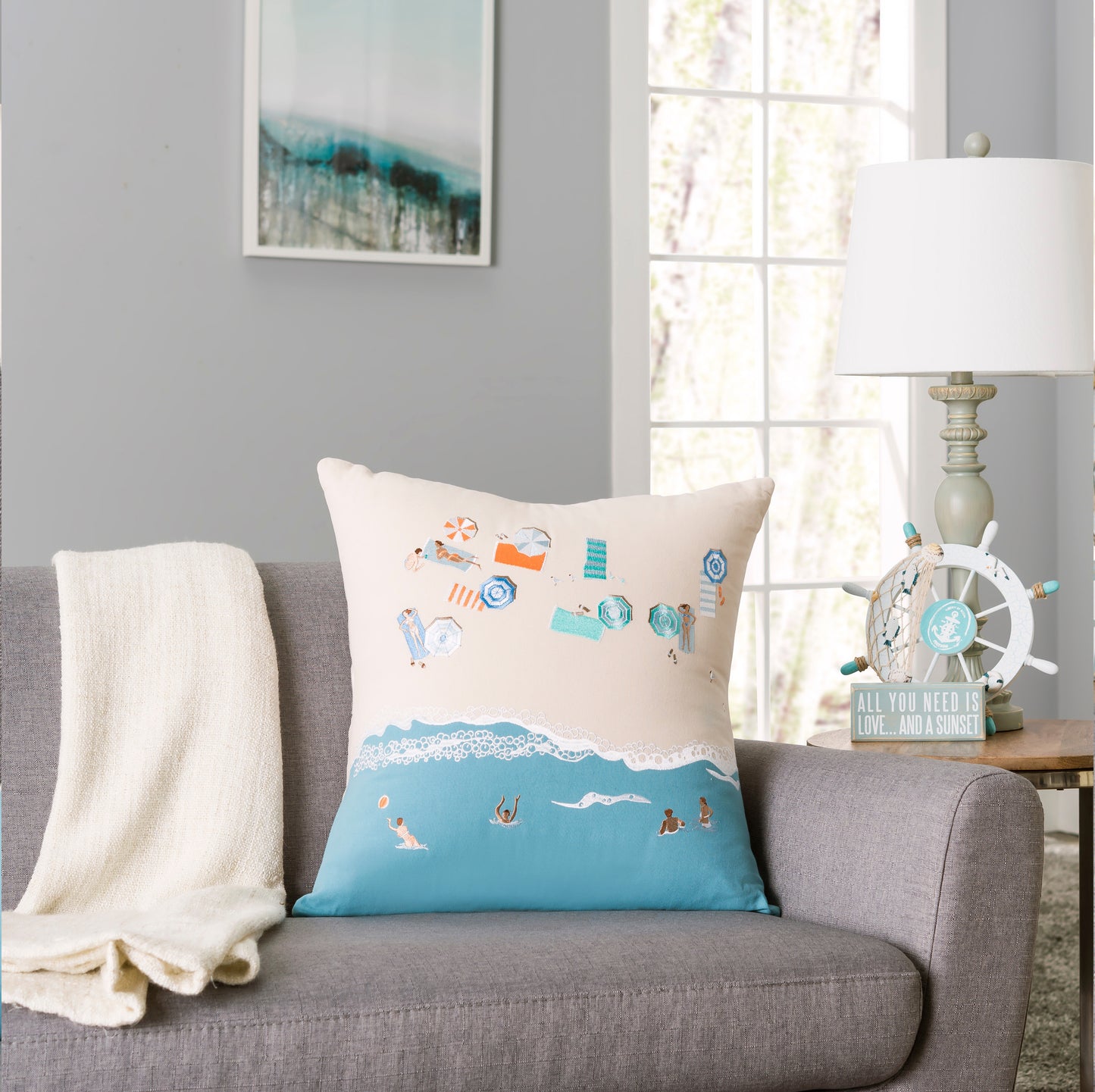 Bird's Eye Beach Scene indoor pillow styled in a coastal themed living room.