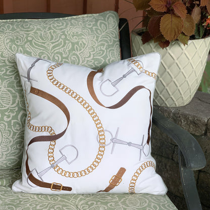 Bits and Leather White outdoor pillow styled on a rod iron bench.