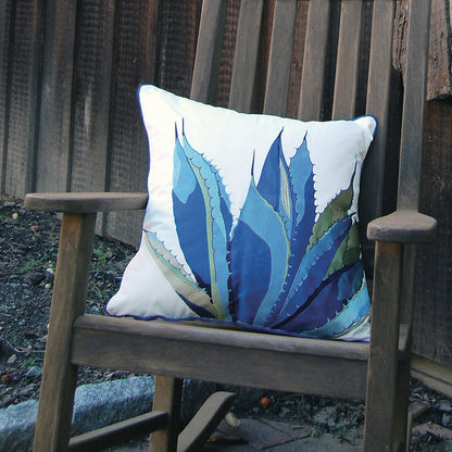 Blue Agave Indoor Outdoor Pillow styled on a wooden rocker.