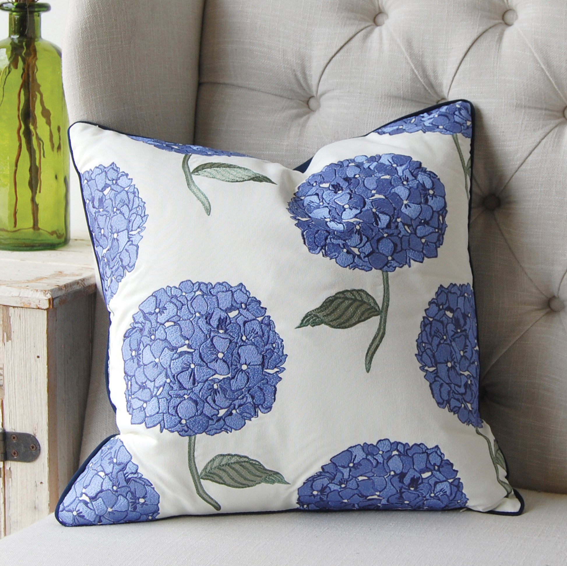 Hydrangea Pattern pillow styled on a tufted sofa.