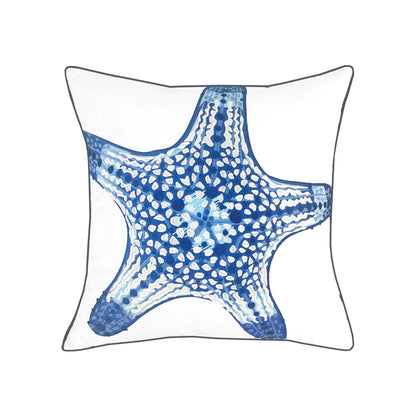 Large blue sea star embroidered on a white ground outdoor pillow with navy blue piped edges.