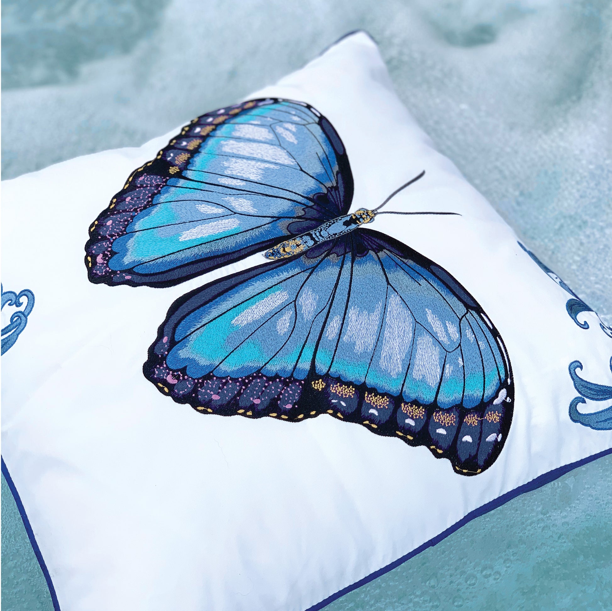 Detail shot of the Bold Blue Butterfly outdoor pillow.