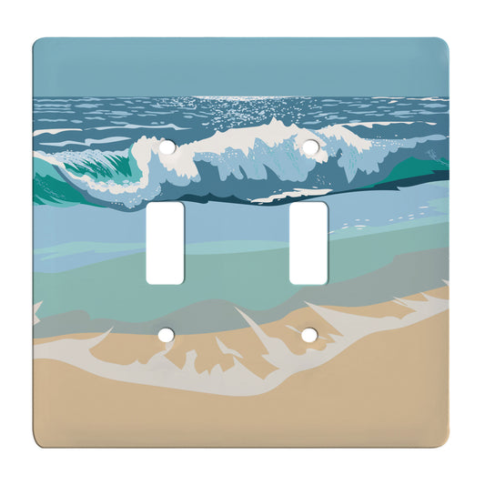 ceramic double toggle switch plate featuring crashing waves upon the sand. 