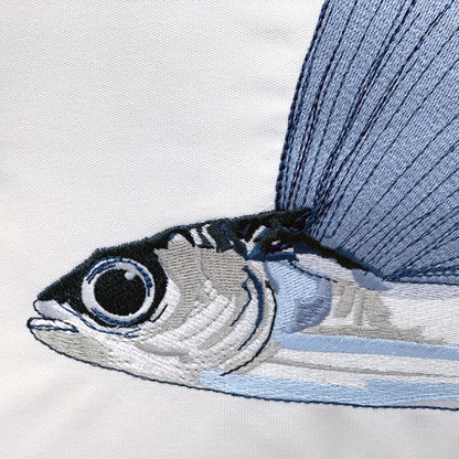 Detail shot of the embroidery on the Can't Catch Me Flying Fish pillow