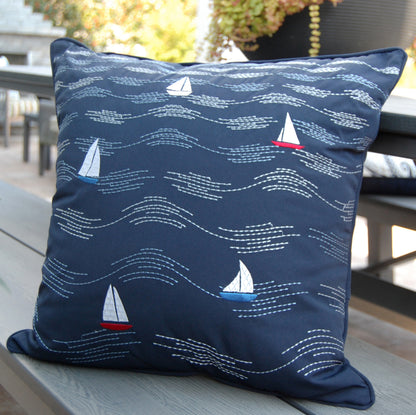 Cape Series Modern Waves pillow styled on an outdoor bench.