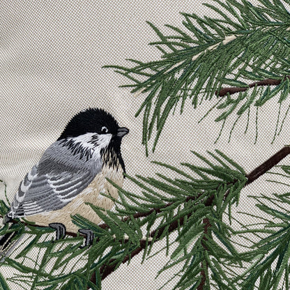 Detail shot of the Chickadee and Bough pillow embroidery. 