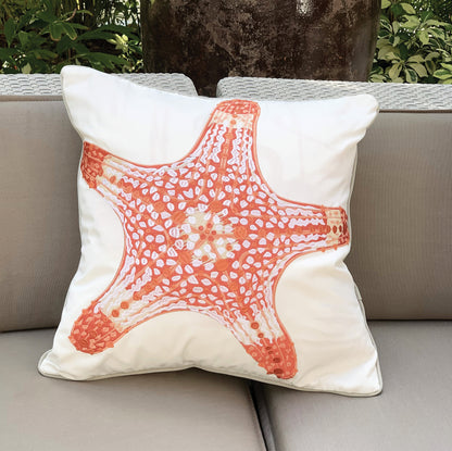 Coral Sea Star pillow styled on an outdoor couch.