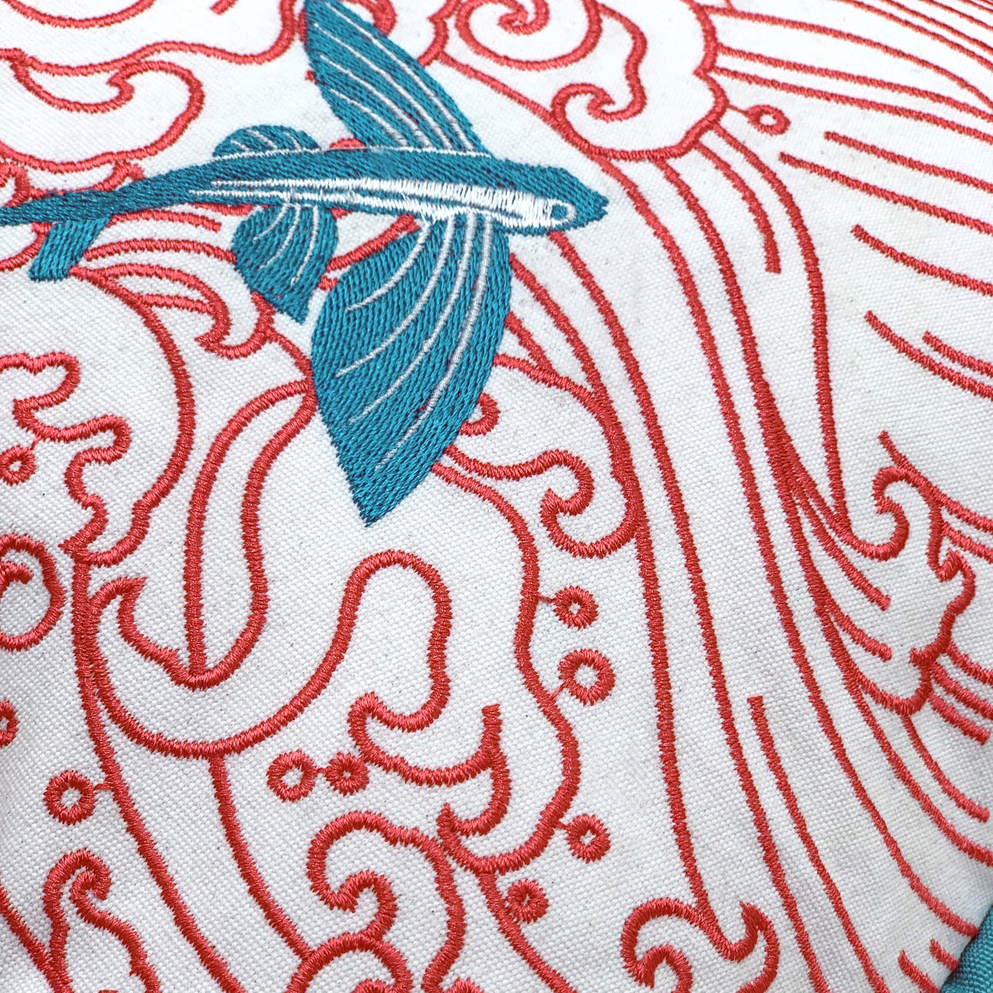 Detail shot of the Coral Waves and Fish pillow embroidery.