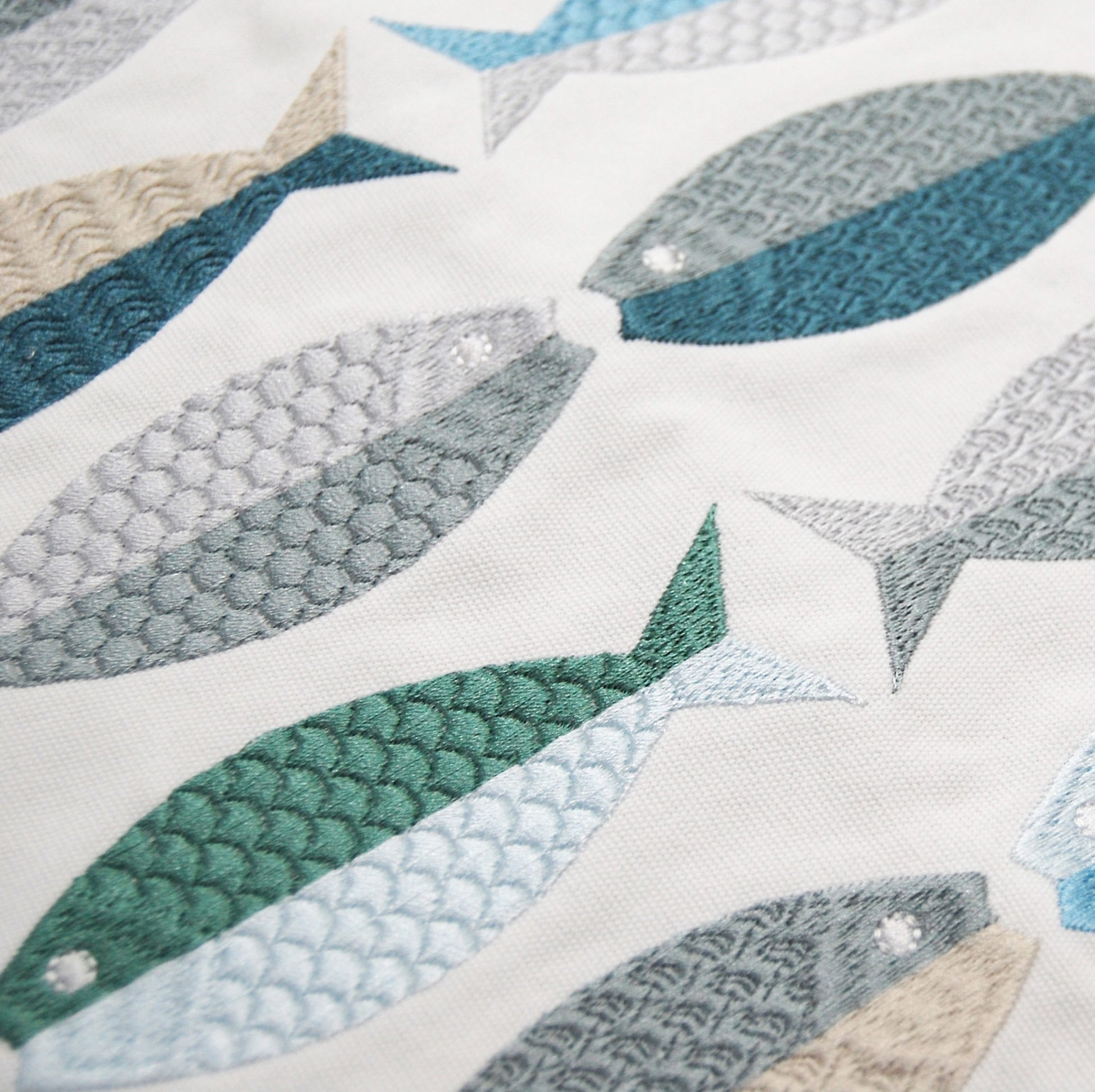 Detail shot of the Fish Pattern Lumbar pillow embroidery.