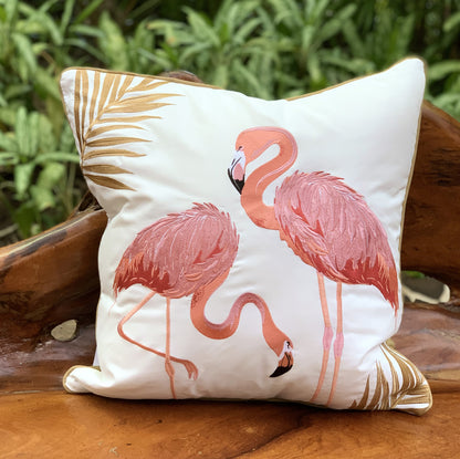 Flamingo Fancy pillow styled in a garden.