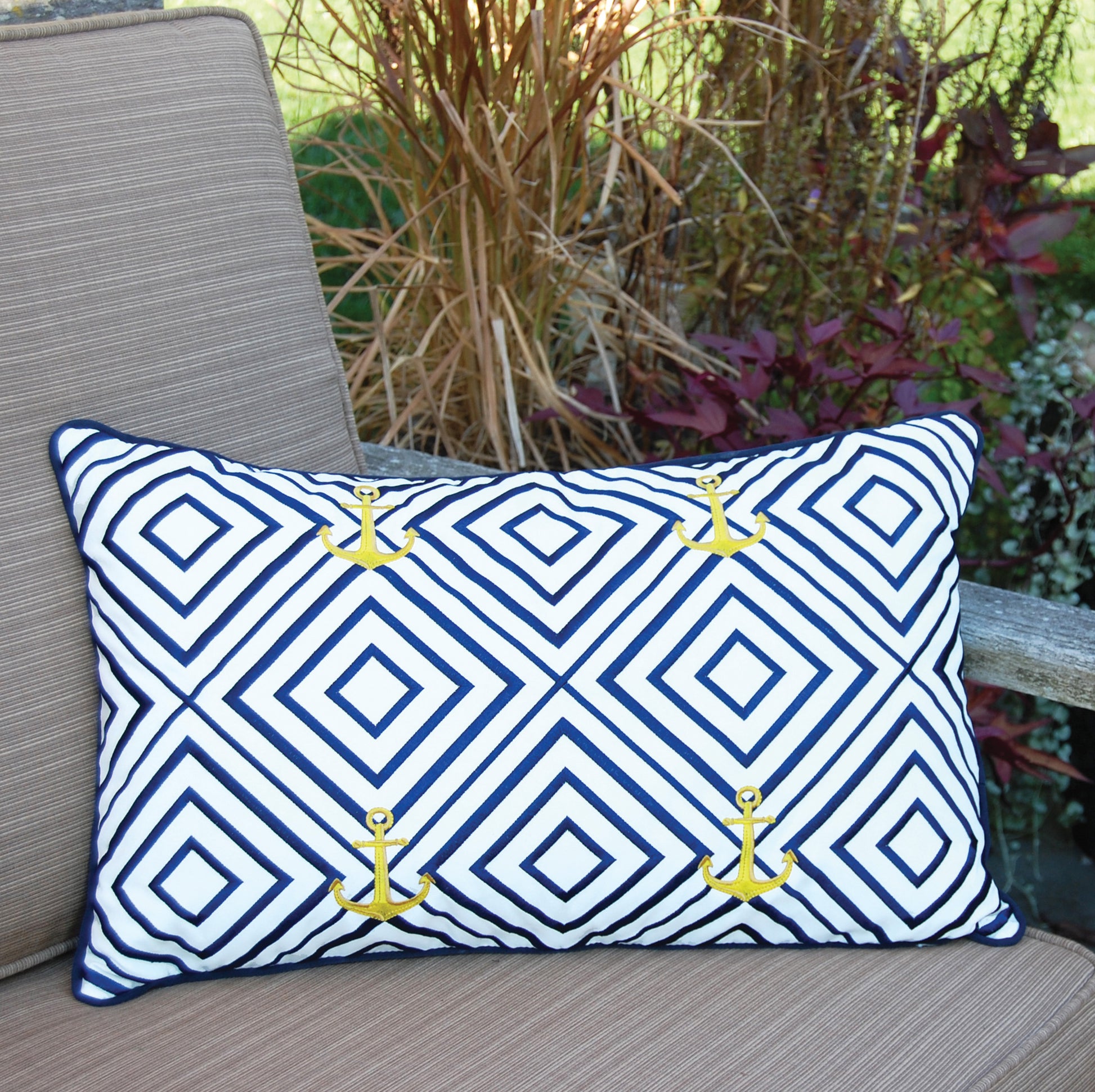 Geo Pattern Nautical pillow styled in a garden.