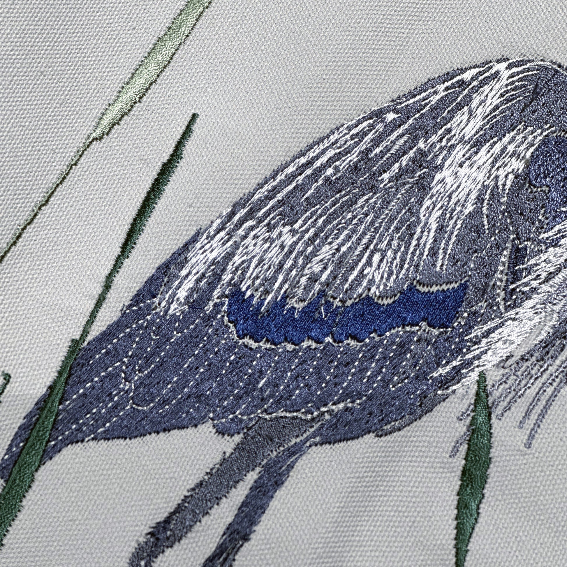 Detail shot of the Great Blue Heron Lumbar Pillow embroidery.