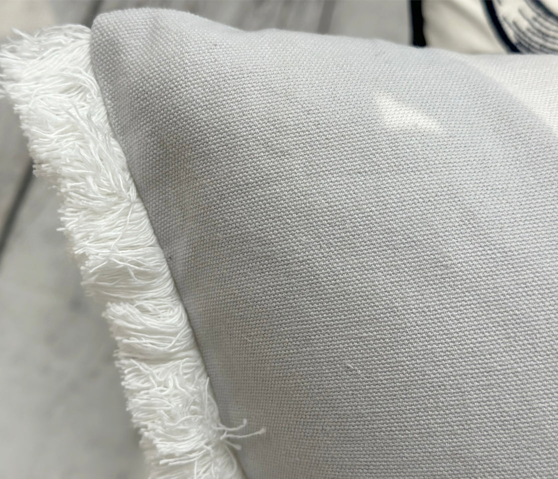 Detail shot of the Great Blue Heron Lumbar Pillow fringe edges.