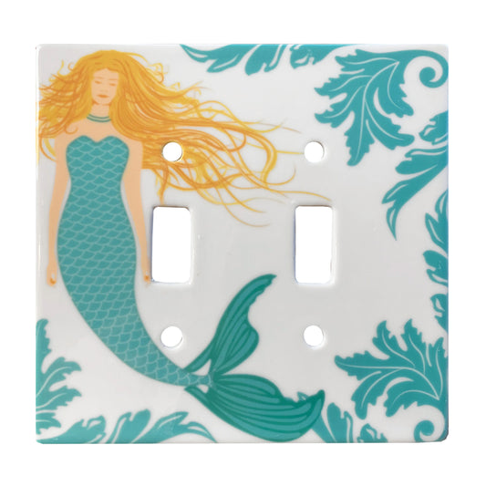 ceramic double toggle switch plate featuring mermaid with green tail and blonde hair as well as green decorative accents.