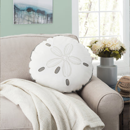 Sand Dollar Shaped pillow styled on a couch.