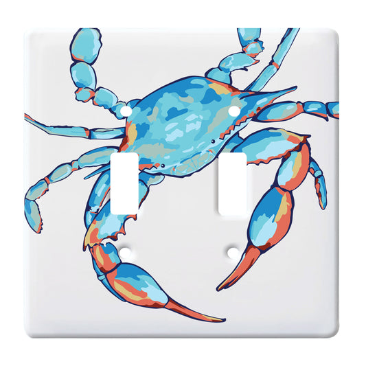 white ceramic double toggle switch plate featuring graphic of blue crab with orange accents.