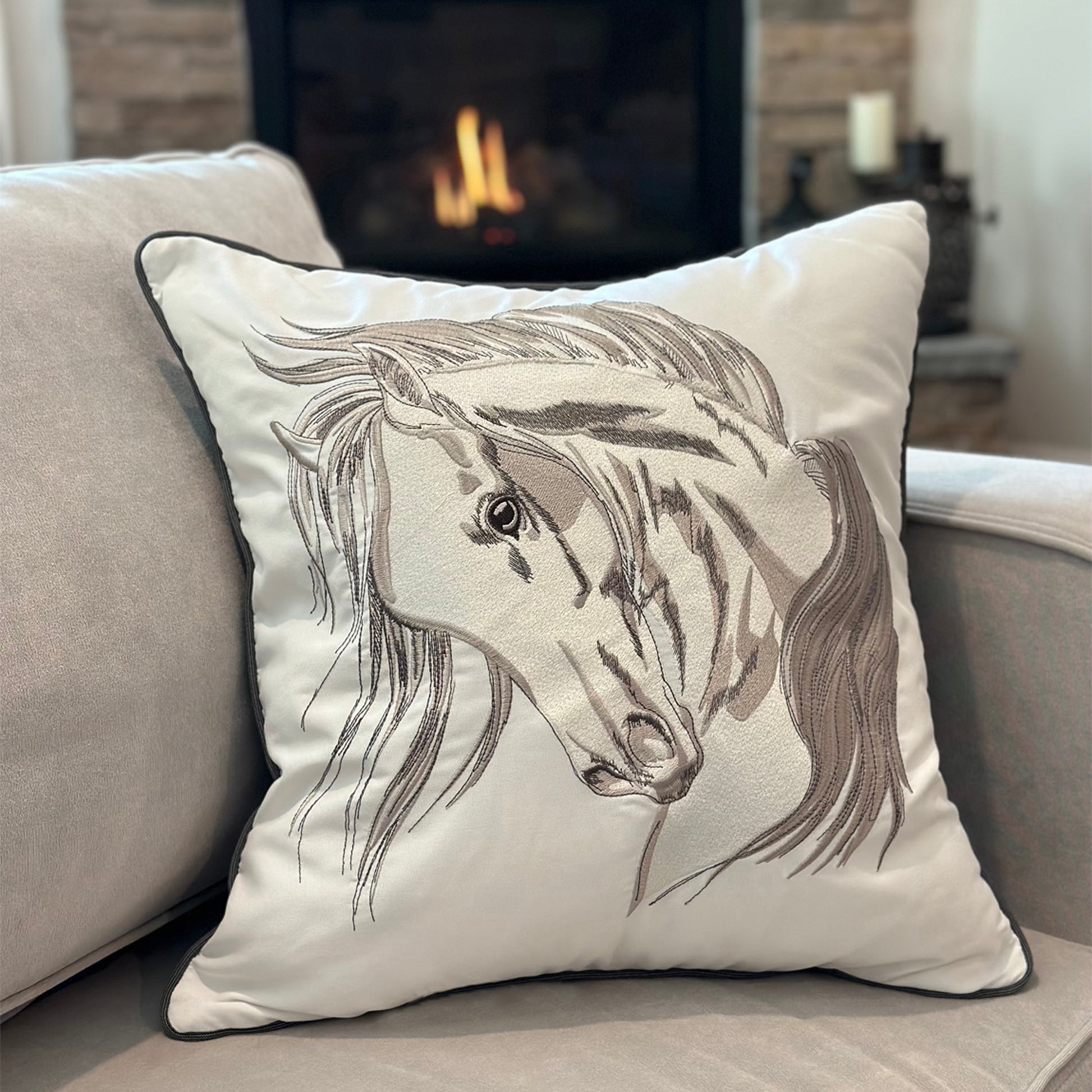 Head Strong Left pillow styled on a grey couch.